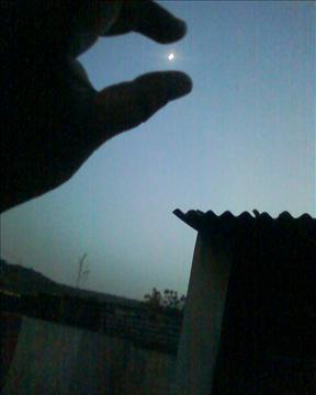 moon in finger