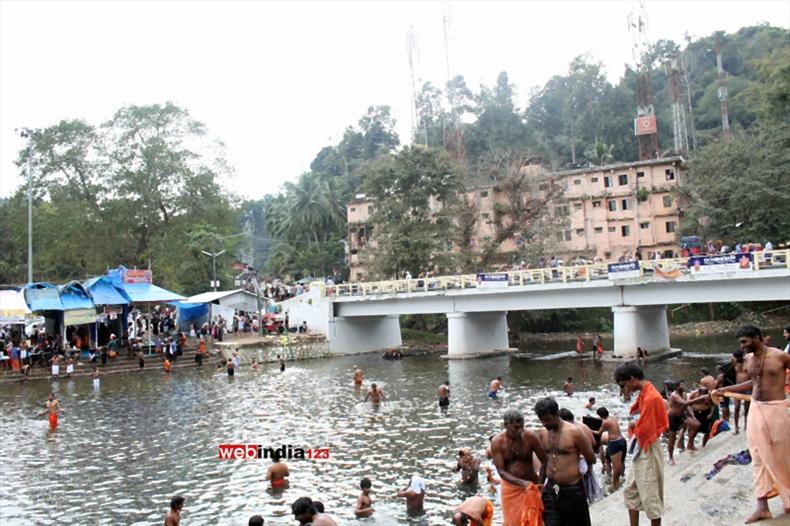 Pilgrims taking a holy dip at Pamba River