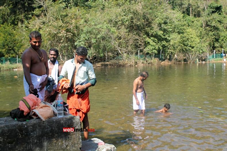 Pilgrims bathing at River Pamba