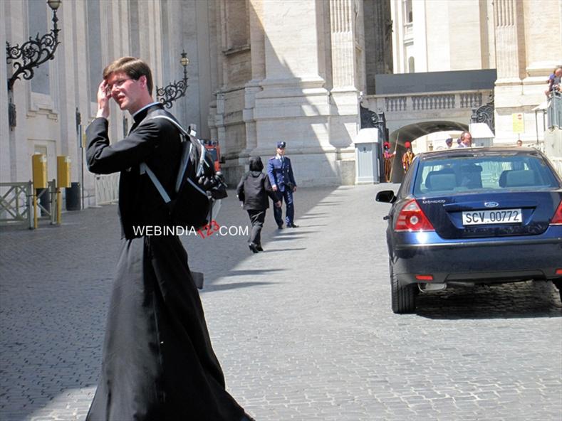 Priest infront of St.Peter`s Square